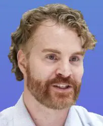 Smiling man with a blue background