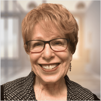 Happy woman in glasses, blurred background