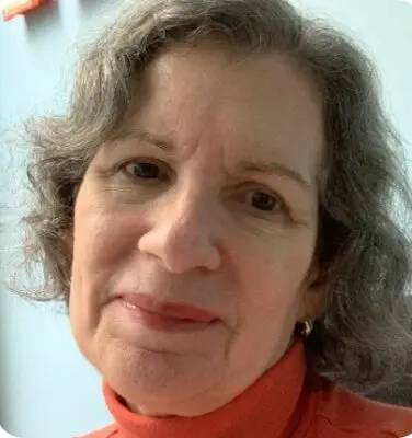 Senior woman with curly hair smiling