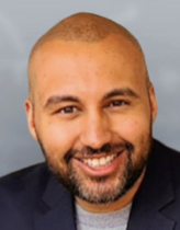 Smiling man with beard and suit