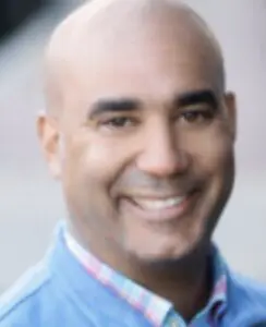 Smiling man in blue shirt