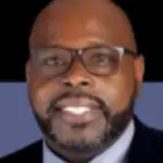 Smiling man with beard and glasses