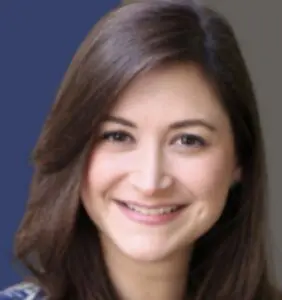 Woman smiling against a soft background