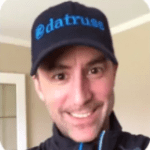 Smiling man in a dark cap