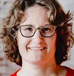 Person wearing glasses and red shirt