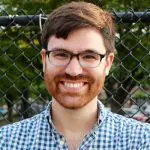 Smiling individual in sunlight