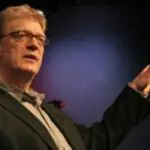 Abstract figure with graduation cap symbolizing education and achievement.