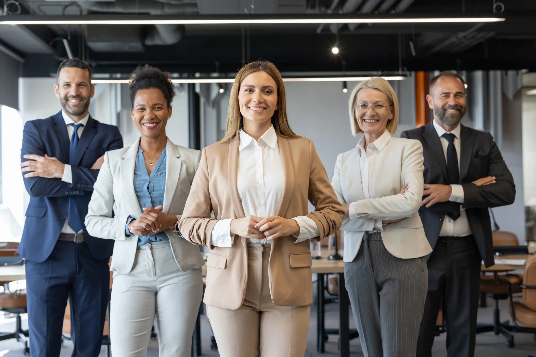 Confident diverse businesswomen standing together in office.