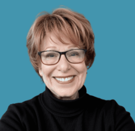 Barbara headshot with teal background