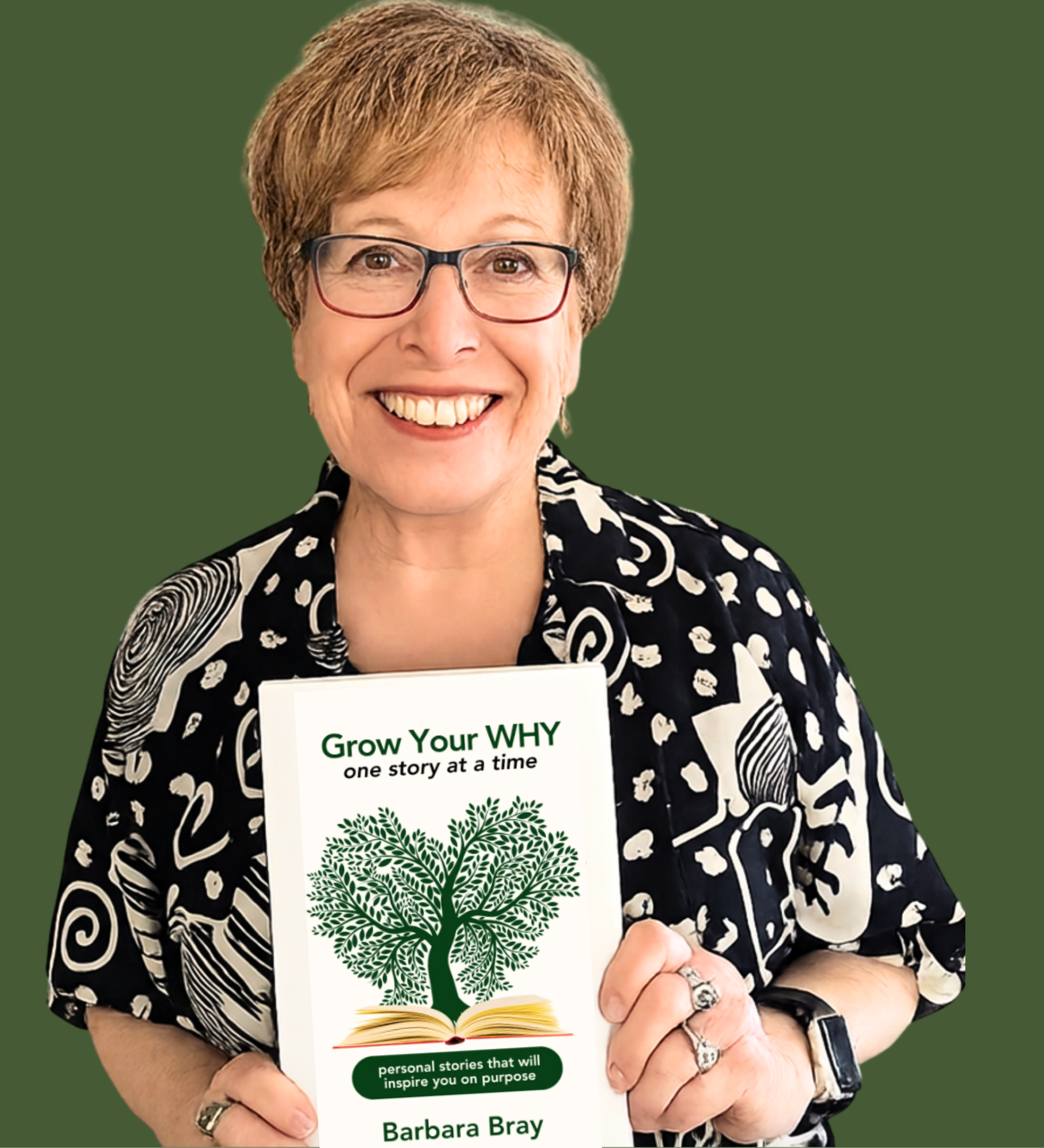 Photo of Barbara holding her book, Grow Your WHY