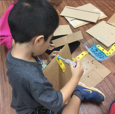 Our Kinders using MakeDo Cardboard Construction tools