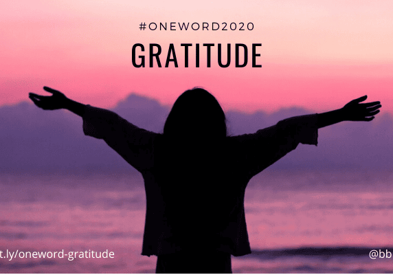 Silhouette embracing gratitude at pink sunrise