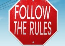 Traffic-style sign with follow the rules text