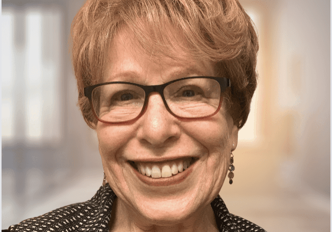 Happy woman with short hair and glasses