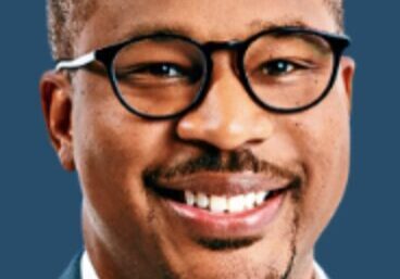 Happy man with glasses, blue background
