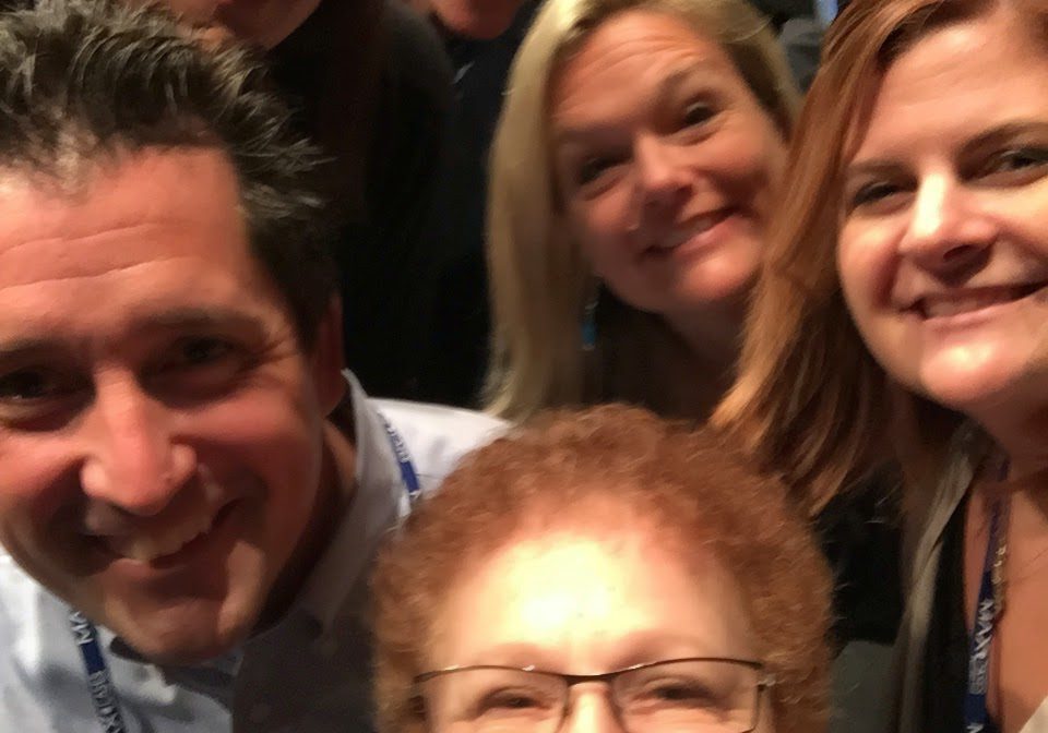 Friends taking a group photo indoors