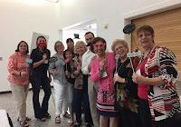 Group posing with photo booth props