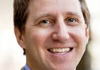 Smiling man in a suit jacket