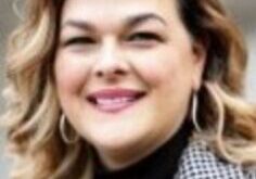 Smiling woman with wavy hair