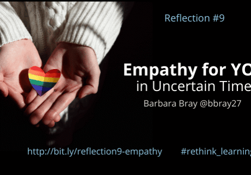 Hands holding rainbow heart with empathy text