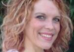 Woman with curly hair, green background