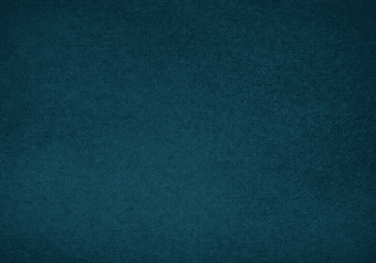 A glowing neon blue skull with intricate details on a dark background.