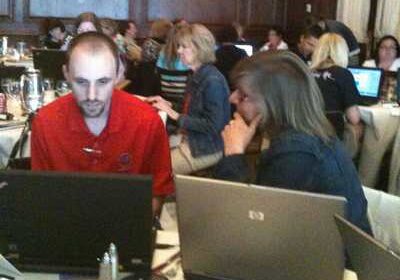 Meeting participants focused on computer screens