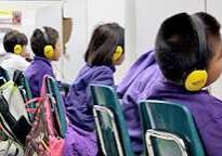 Children learning with headphones in school