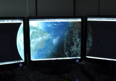 Triple screens showing cosmic scenes.