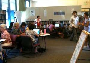 People working on laptops in library