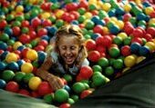 Joyful kid in play area
